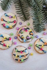 Traditional home made Christmas Lights Cookies on a festive christmas background