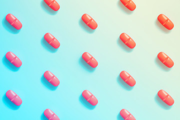 pattern of red pills on a colorful background. concept of hallucinations.