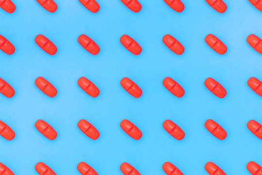 Set Of Red Pills On Blue Background. Red Pill Pattern.