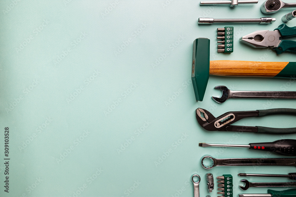 Wall mural Set of tools over blue background, top view with space for text