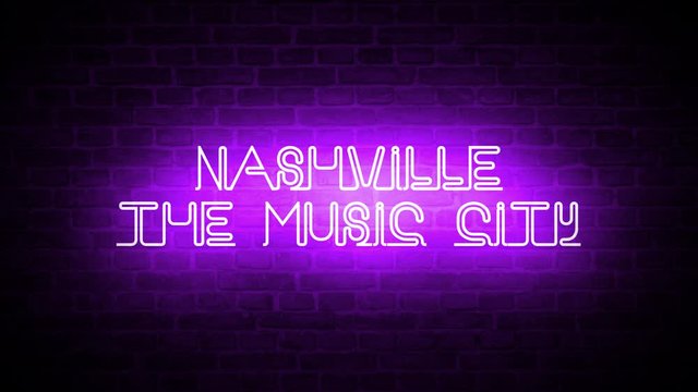 A video of a neon sign against a brick wall that reads: Nashville The Music City