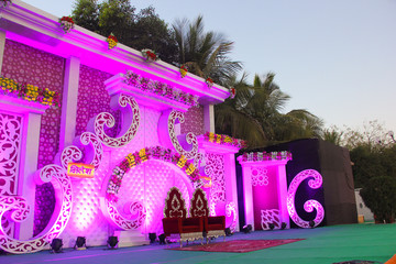 indian wedding ceremony :stage decoration with lighting and flower 