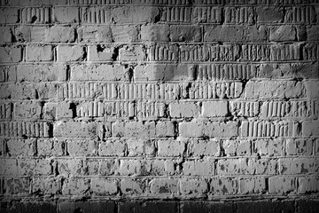 Old brick wall texture close up. Monochrome abstract background