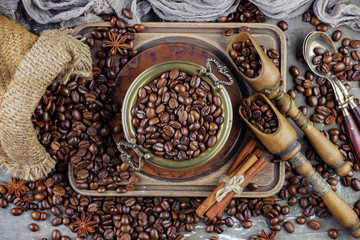Coffee in a cup on a background of coffee beans, on an old background.