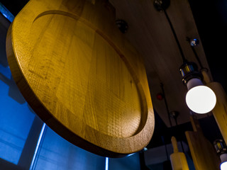 Wooden pizza circle plate hanging from above