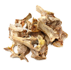 Animal vertebrae bones isolated on white background. leftover food closeup