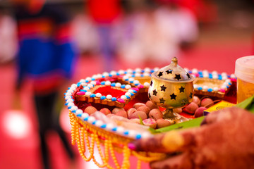 Traditional indian wedding ceremony in Hinduism : puja thali with areca nut 