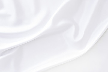 White gray satin texture that is white silver fabric silk background with beautiful soft blur pattern natural.