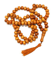 Natural wooden rosary isolated on white background