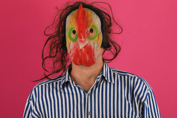 close-up portrait of a man in a mask of a rooster