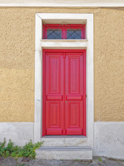 vintage house entrance painted red wooden door with white frame