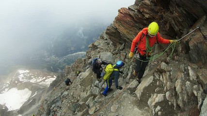 Men are climbing to the top of the mountain. Mount Blanc Mountain. Alps