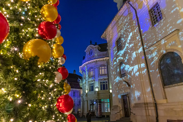 Christmas market and decoration lights in Sibiu main square, Transylvania, Romania. Winter tale at Christmas Market