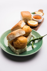 Egg Vada Pav or Anda  Wada Paav / Pao is a non-Vegetarian Fast Food Dish From Maharashtra, India