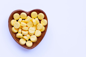 Yellow tablets of Paracetamol on white