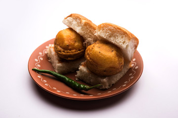 Egg Vada Pav or Anda  Wada Paav / Pao is a non-Vegetarian Fast Food Dish From Maharashtra, India