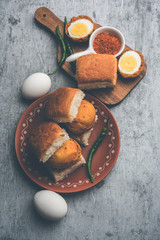 Egg Vada Pav or Anda  Wada Paav / Pao is a non-Vegetarian Fast Food Dish From Maharashtra, India