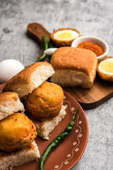 Egg Vada Pav or Anda  Wada Paav / Pao is a non-Vegetarian Fast Food Dish From Maharashtra, India