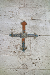 Cross on a wall of a Street in Bari