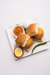 Egg Vada Pav or Anda  Wada Paav / Pao is a non-Vegetarian Fast Food Dish From Maharashtra, India