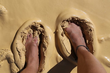 Feet stuck in natural clay in eastern Australia, Rainbow beach