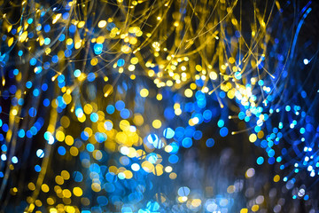 Abstract blur gold sparkle bokeh background. Dark background Festive christmas background....
