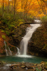 Fototapeta na wymiar Hiking trail in Autumn , Fukushima Prefecture with waterfall