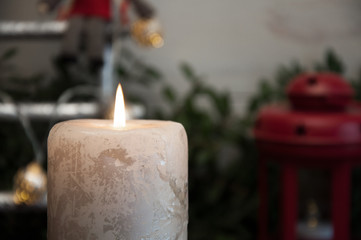 Big burning candle on New Year and Christmas background
