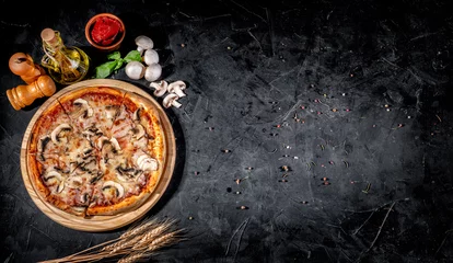 Rolgordijnen Traditional Italian pizza, vegetables, ingredients on a dark background. Top view with copy space. Pizza menu © Andrii