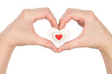 Obraz premium Red heart in woman hand isolated.