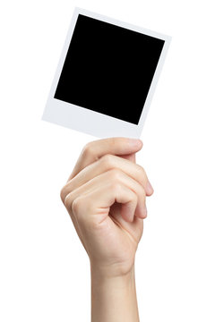 Hand holding blank photocard, isolated on white background