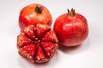 Sweet pomegranate isolated on white background.