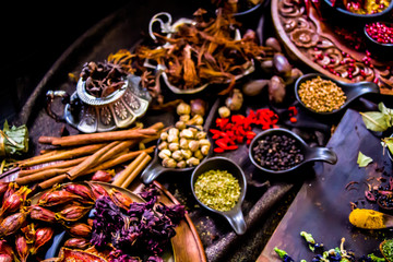 Top view Thai spices and herbs ingredient decoration on wood table for cook in home kitchen. 