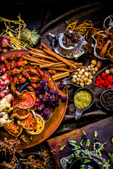 Top view Thai spices and herbs ingredient decoration on wood table for cook in home kitchen. 