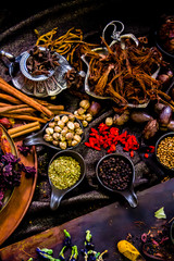Obraz na płótnie Canvas Top view Thai spices and herbs ingredient decoration on wood table for cook in home kitchen. 