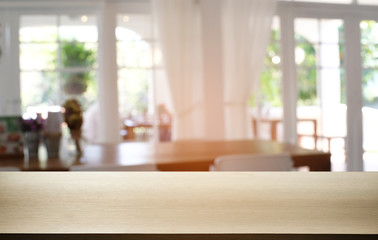 Empty dark wooden table in front of abstract blurred bokeh background of restaurant . can be used for display or montage your products.Mock up for space.