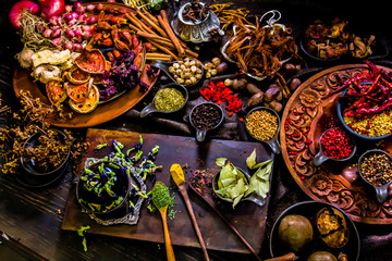 Top view Thai spices and herbs ingredient decoration on wood table for cook in home kitchen. 