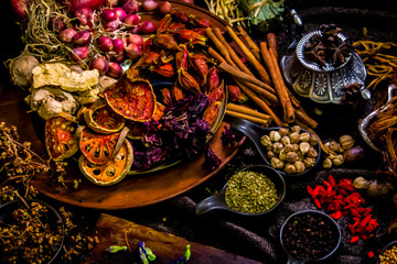 Top view Thai spices and herbs ingredient decoration on wood table for cook in home kitchen. 
