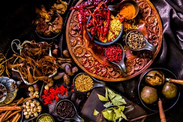 Top view Thai spices and herbs ingredient decoration on wood table for cook in home kitchen. 