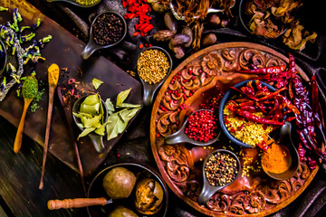 Top view Thai spices and herbs ingredient decoration on wood table for cook in home kitchen. 