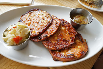 Close up fried chili Bologna served with coleslaw and dipping sauce