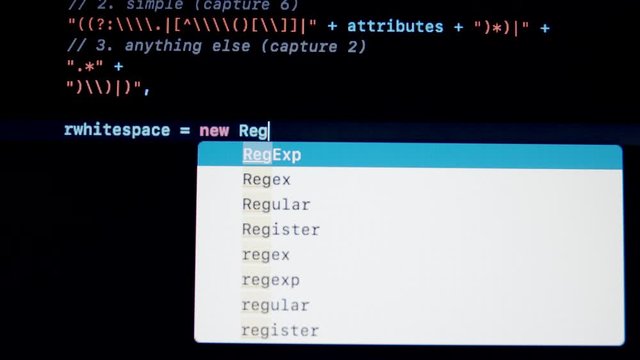 Developer type JavaScript js programming code on laptop screen
