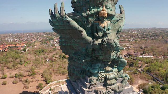 Garuda Wisnu Kencana Cultural Park Bali's Iconic Landmark God. Bird God is called GWK park has statue third biggest in world. Bali Indonesia filmed with drone in 4k.