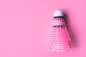 Two pink shuttlecock with white tip for tennis on a pastel dusty pink background. Flatlay. Place for text. Sports female badminton concept