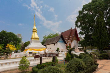 Fototapeta na wymiar Wat Phrathat Kham Kaen is a Buddhist temple in Khon Kaen Province, Thailand. (Thai letter sign is the name of pagoda 