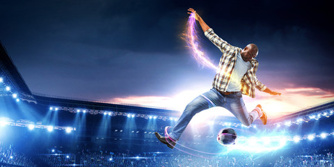 Soccer man in action with ball. Mixed media