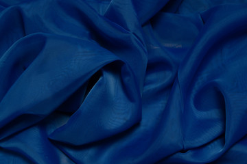 Classic blue silk fabric background. Color of the 2020 year 