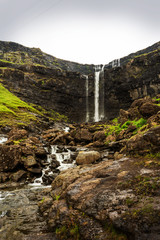 Panoramic vertical photo of Fossa waterfall, Faroe Islands.