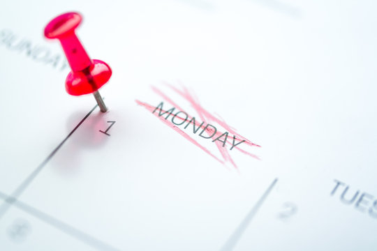 Red push pin on calendar every 1st of the month