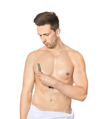 Handsome young man shaving torso on white background